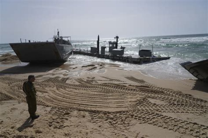 Aid deliveries suspended after rough seas damage US-built temporary pier in Gaza