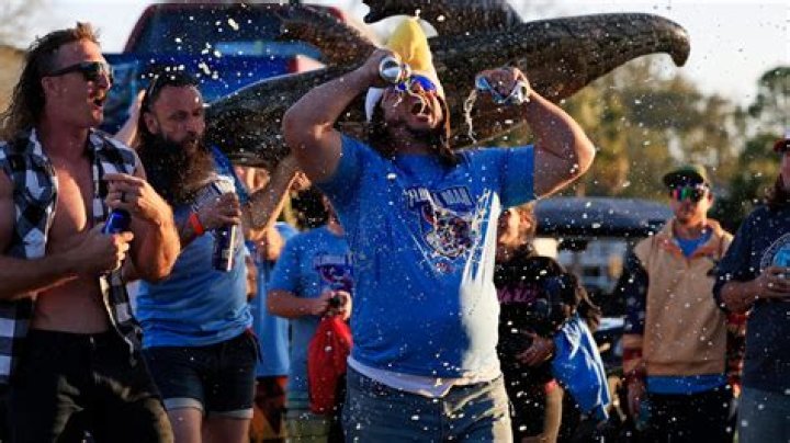 	At the Florida Man Games, big crowds cheer competitors evading police, wrestling over beer	