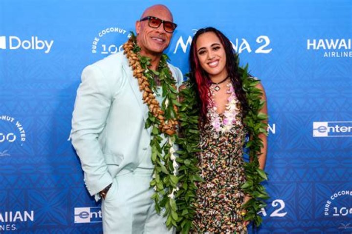 DWAYNE JOHNSON AND DAUGHTER POSE AT HOLLYWOOD PREMIERE