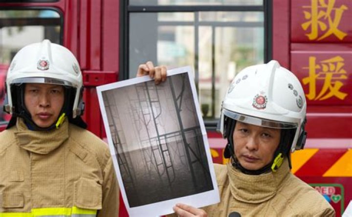 Firefighters enter Hong Kong construction site to fight blaze burning for 24 hours