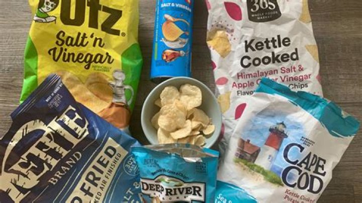 Kelly Stables could not hold her laugh as her son tries salt and vinegar chips for the first time
