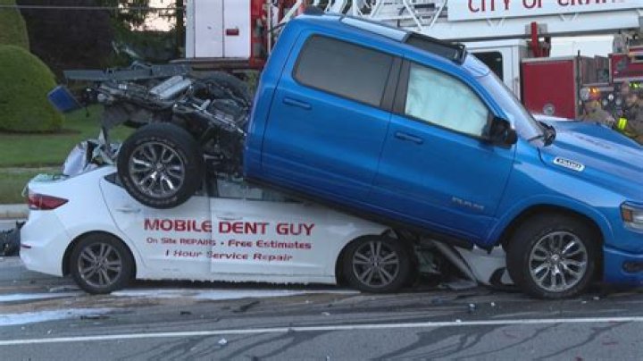 Truck goes airborne in crash before landing on car